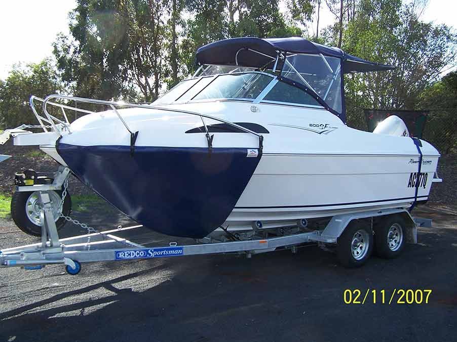White Boat on a Trailer With a Dark Blue Front Cover — Toowoomba Shade & Canvas in Harristown, QLD