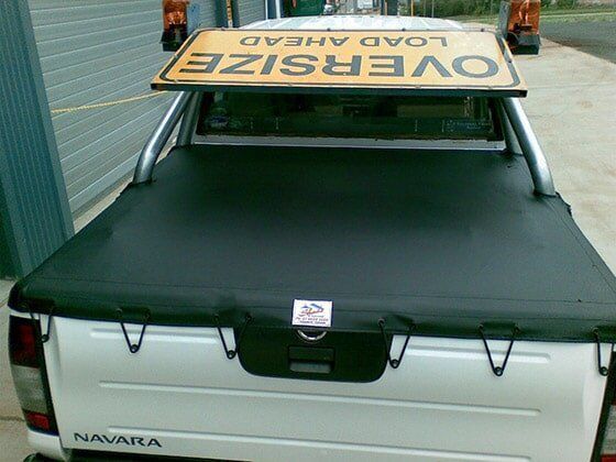 White Pickup Truck With Black Tonneau Cover — Toowoomba Shade & Canvas in Harristown, QLD