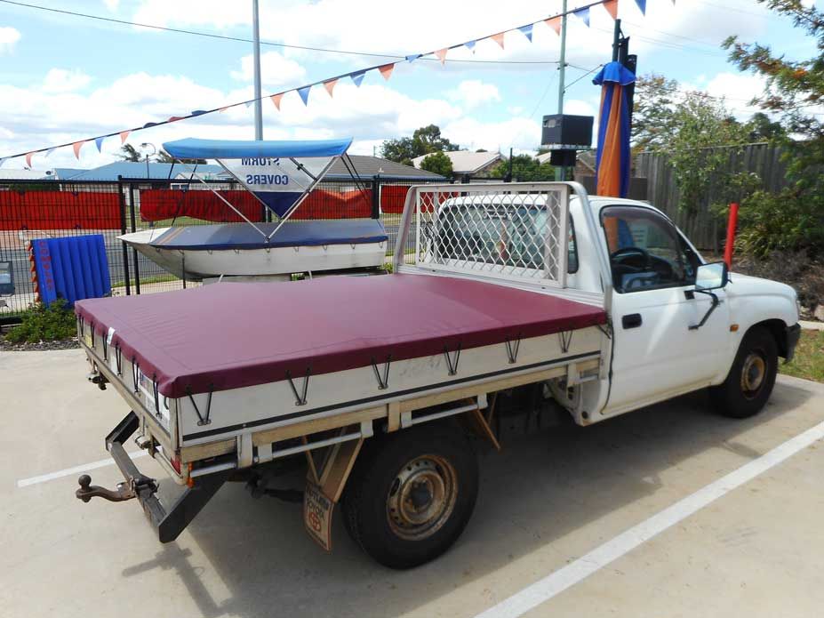 White Pickup Truck With a Burgundy Tonneau Cover — Toowoomba Shade & Canvas in Harristown, QLD