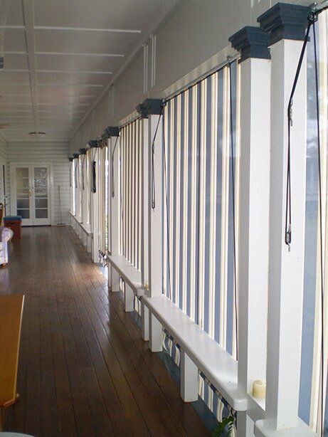 Covered Porch With White Columns and Blue-topped Pillars — Toowoomba Shade & Canvas in Harristown, QLD