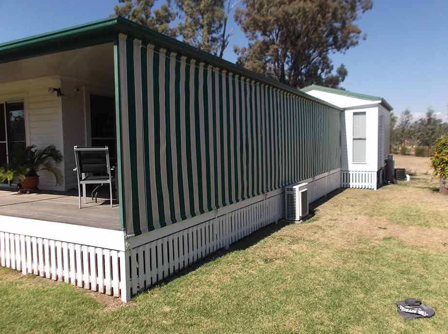 A Home With Green and White Striped Awnings — Toowoomba Shade & Canvas in Harristown, QLD