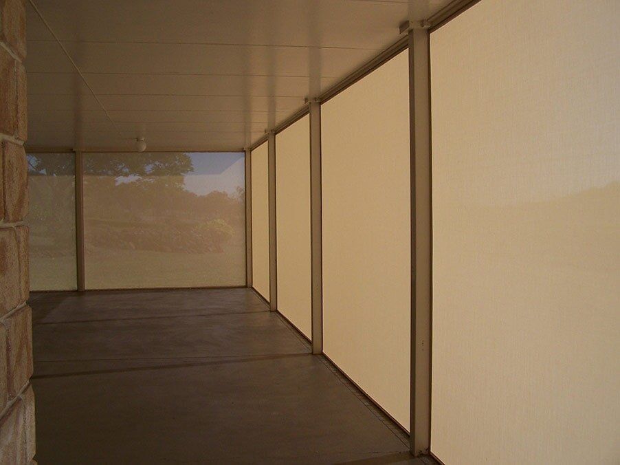 Covered patio with cream-colored blinds along the outer wall — Toowoomba Shade & Canvas in Harristown, QLD