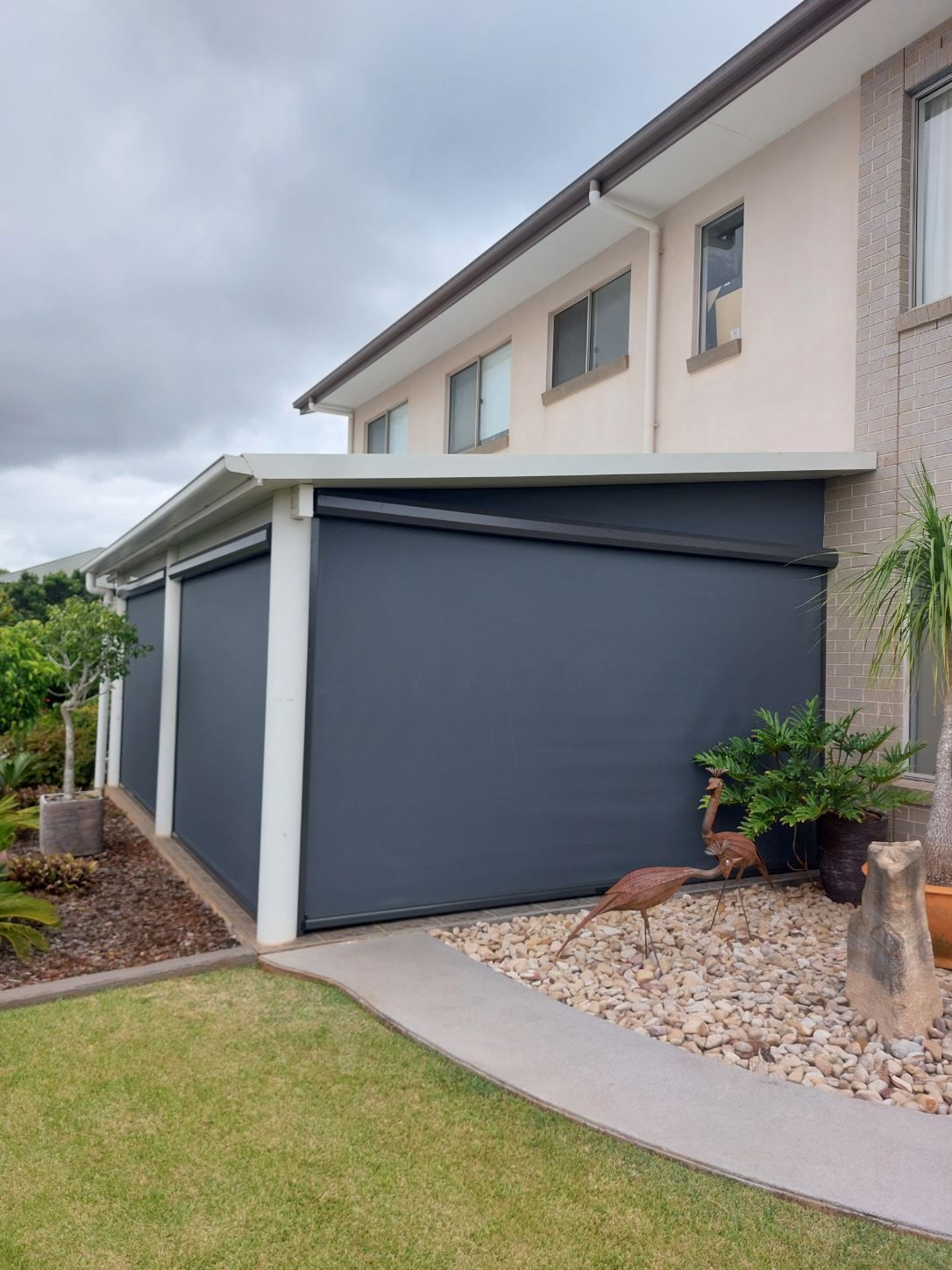 Gray Outdoor Blinds on a Two-story Building — Toowoomba Shade & Canvas in Harristown, QLD