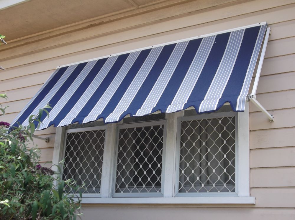 Blue and White Striped Awning Over a Window With Three Panes — Toowoomba Shade & Canvas in Gatton, QLD