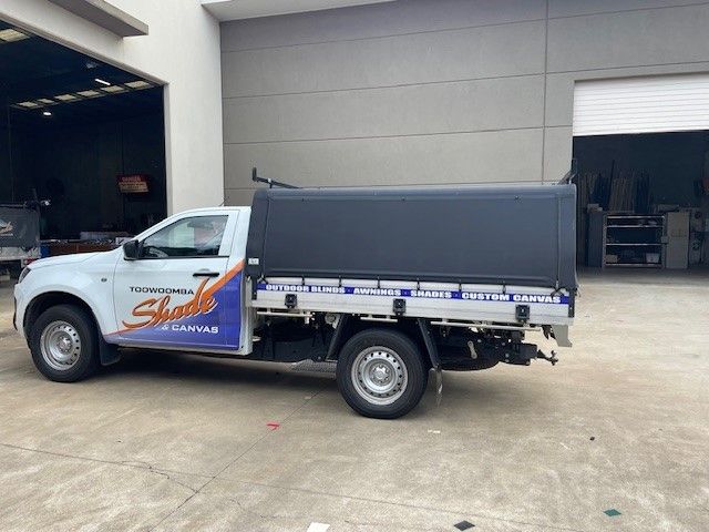 White Pickup Truck With a Black Canopy Parked Outside a Building — Toowoomba Shade & Canvas in Harristown, QLD