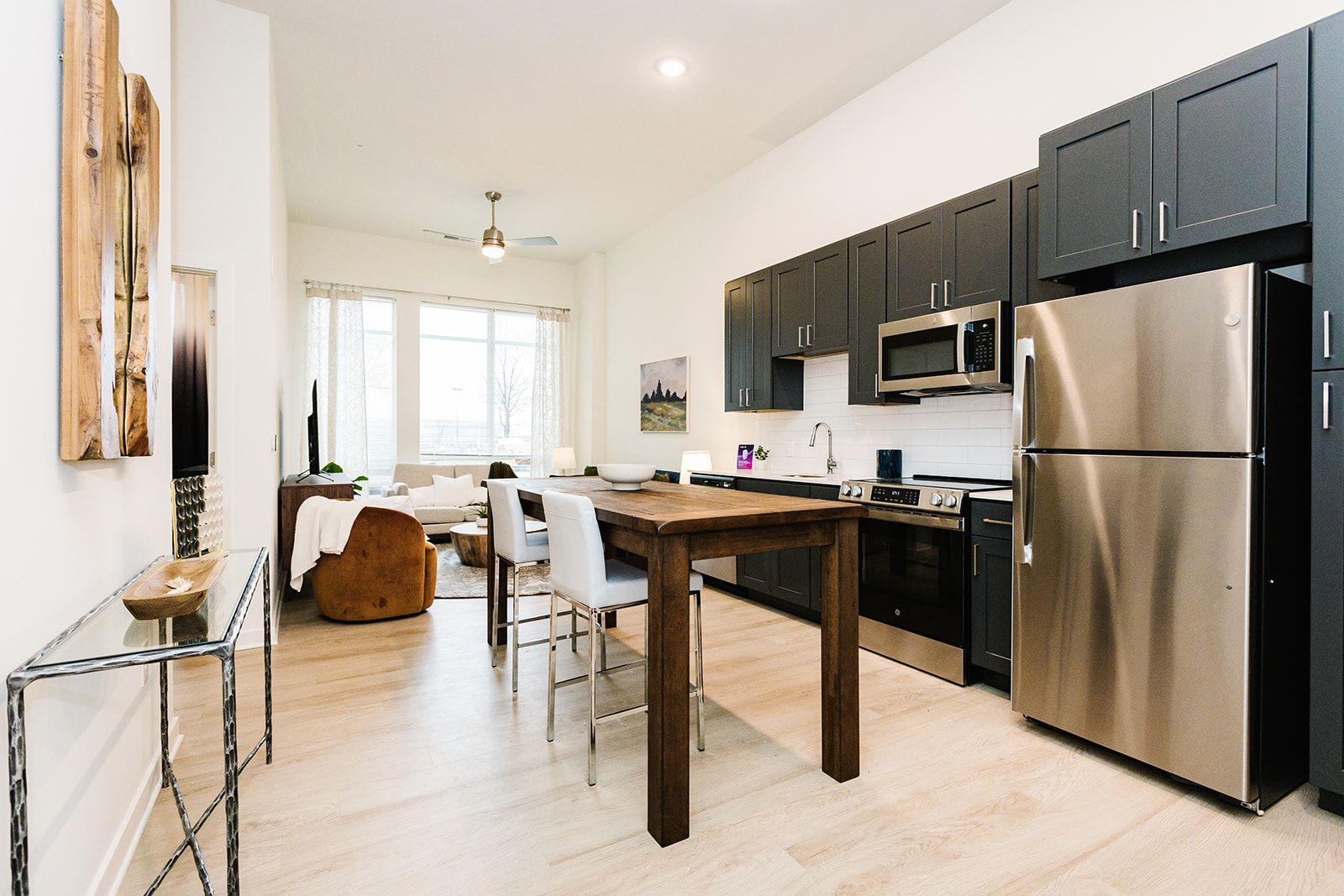 Apartment kitchen with stainless steel appliances and island at Opal Largo Station Apartments in Largo, MD.