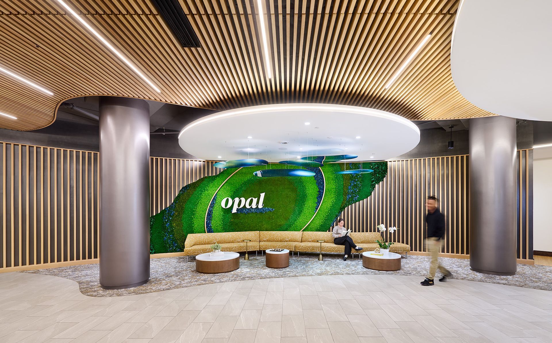 Modern lobby with Opal feature wall and lounge seating at Opal Largo Station Apartments in Largo, MD.
