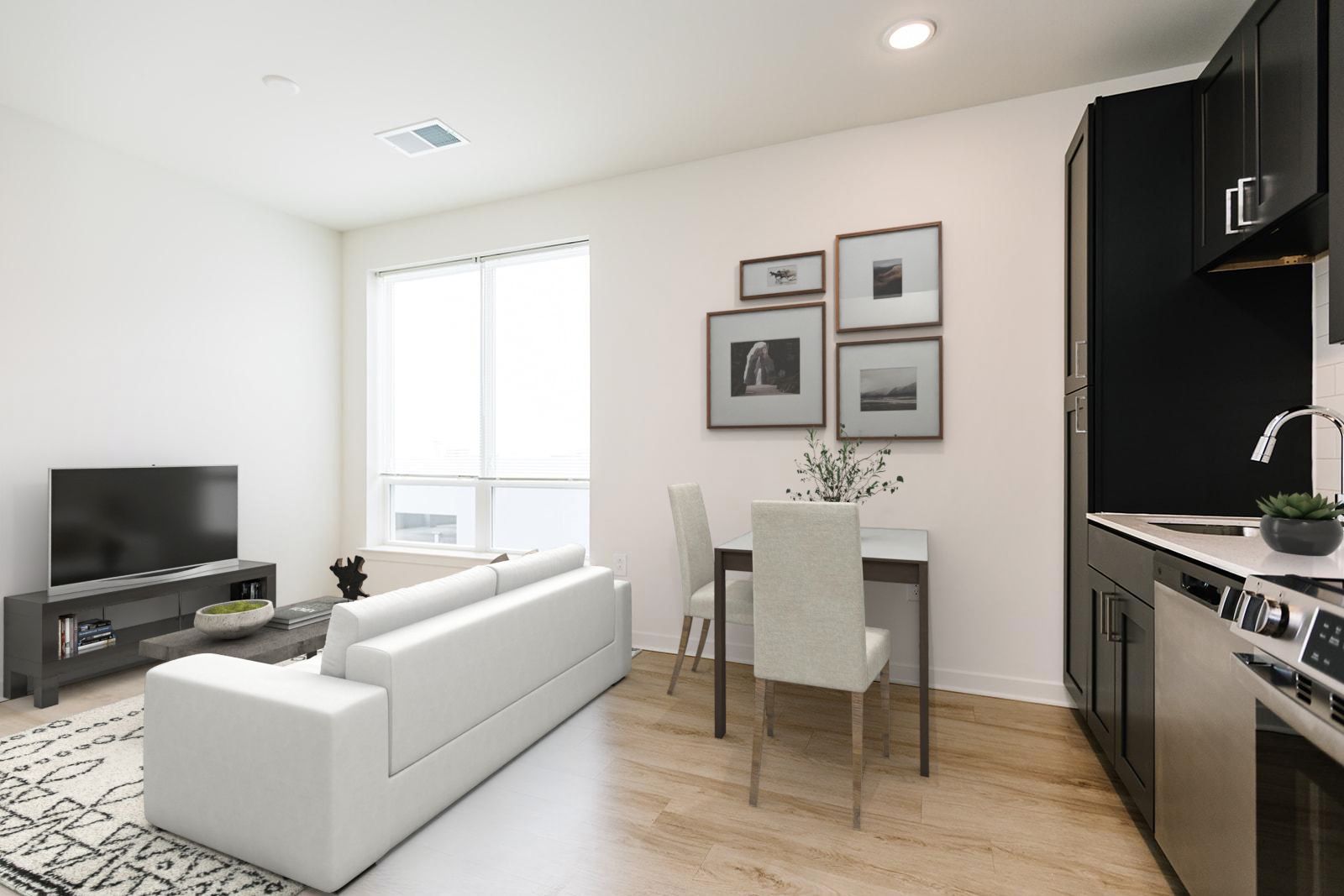 Bedroom with modern furnishings and attached bathroom at Opal Largo Station Apartments in Largo, MD.