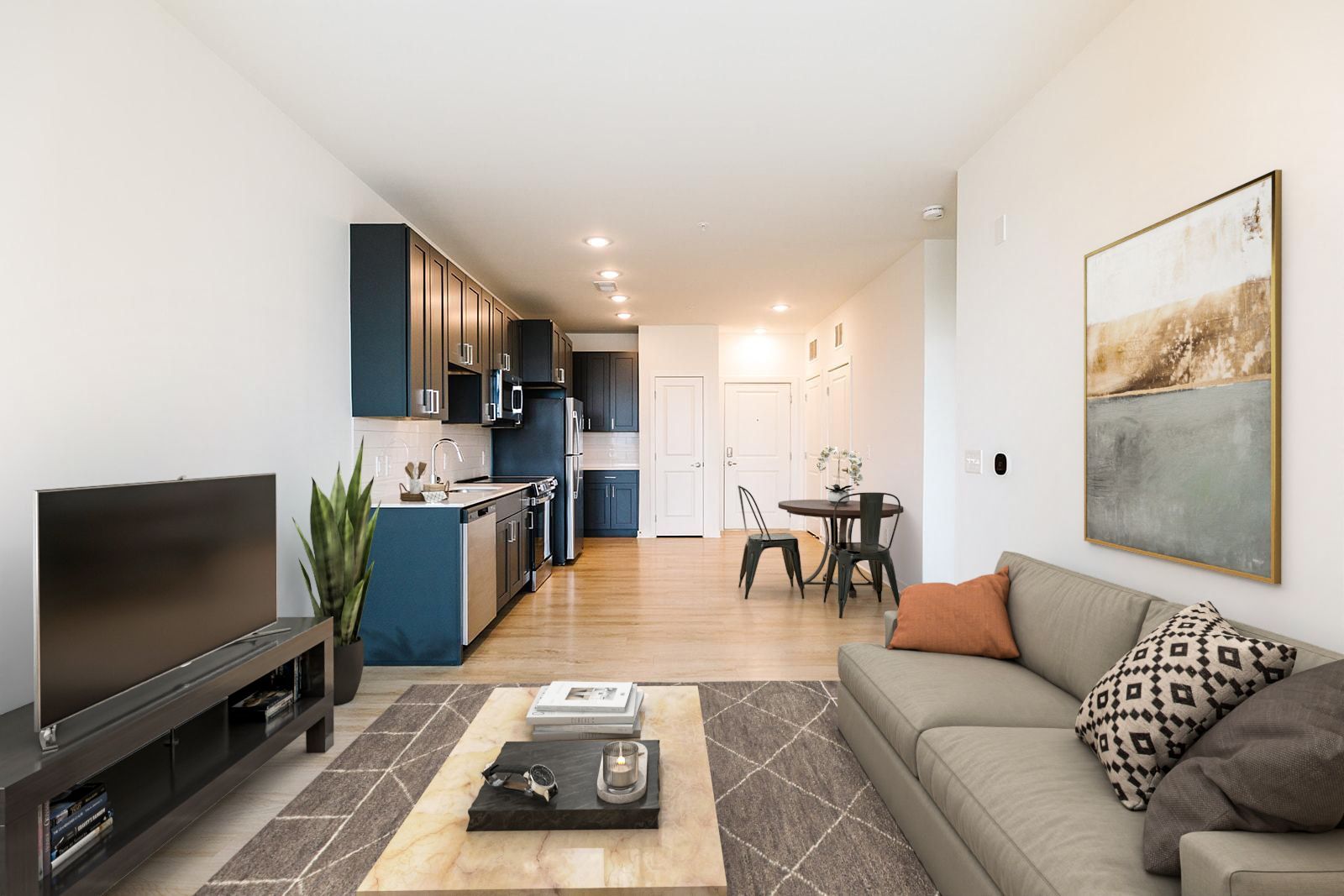 Open-concept kitchen and living room with stainless steel appliances at Opal Largo Station Apartments in Largo, MD.