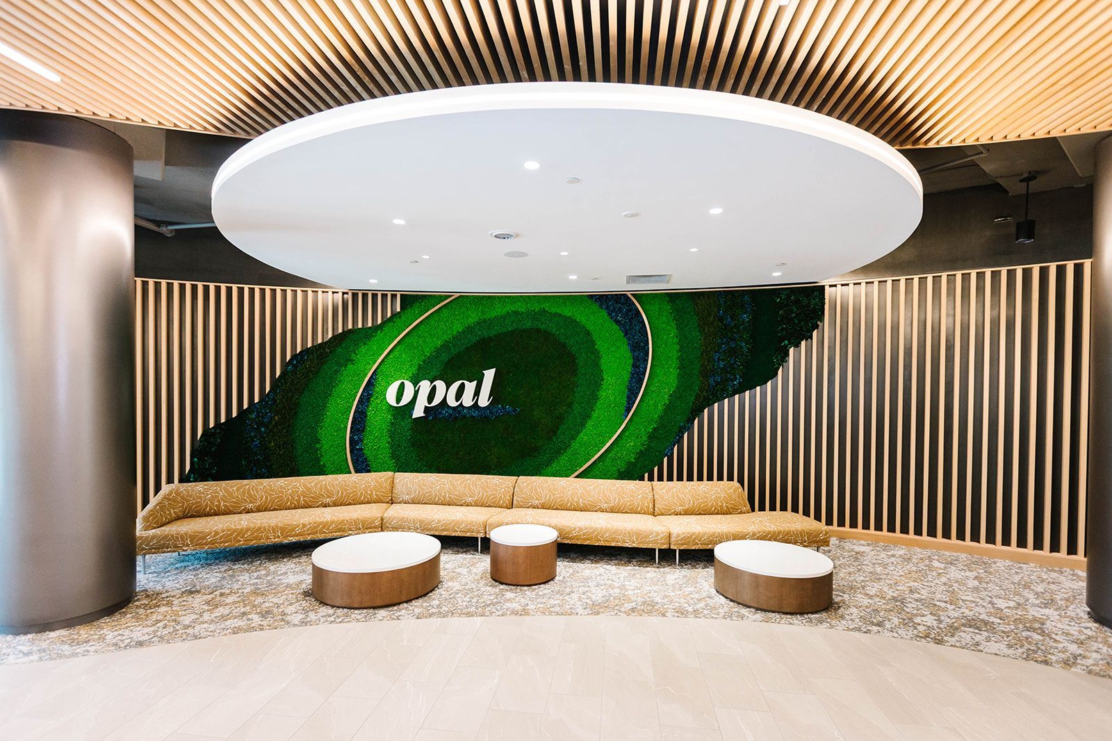 Modern lobby with Opal signage and lounge seating at Opal Largo Station Apartments in Largo, MD.