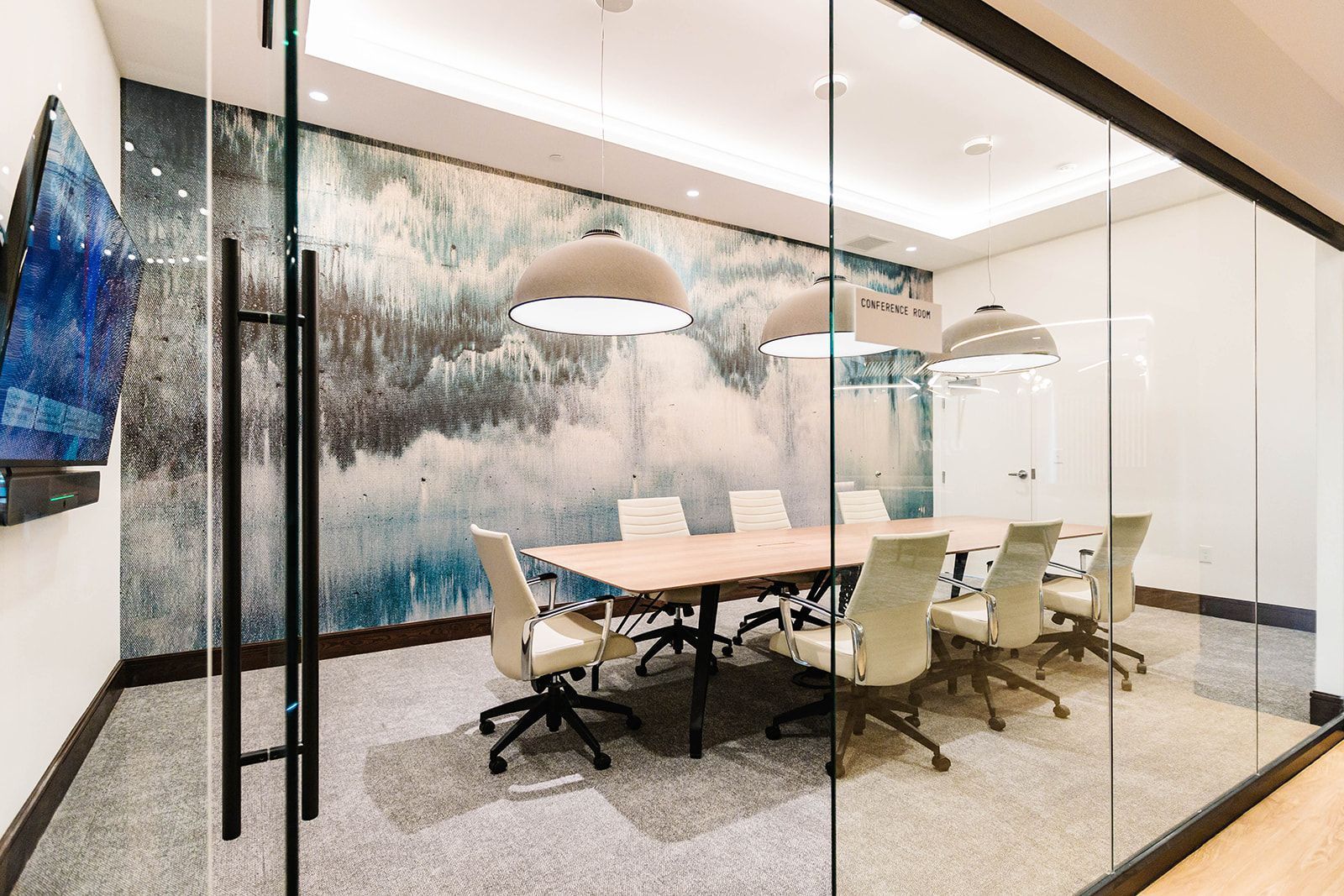 Conference room with table and office seating at Opal Largo Station Apartments in Largo, MD.