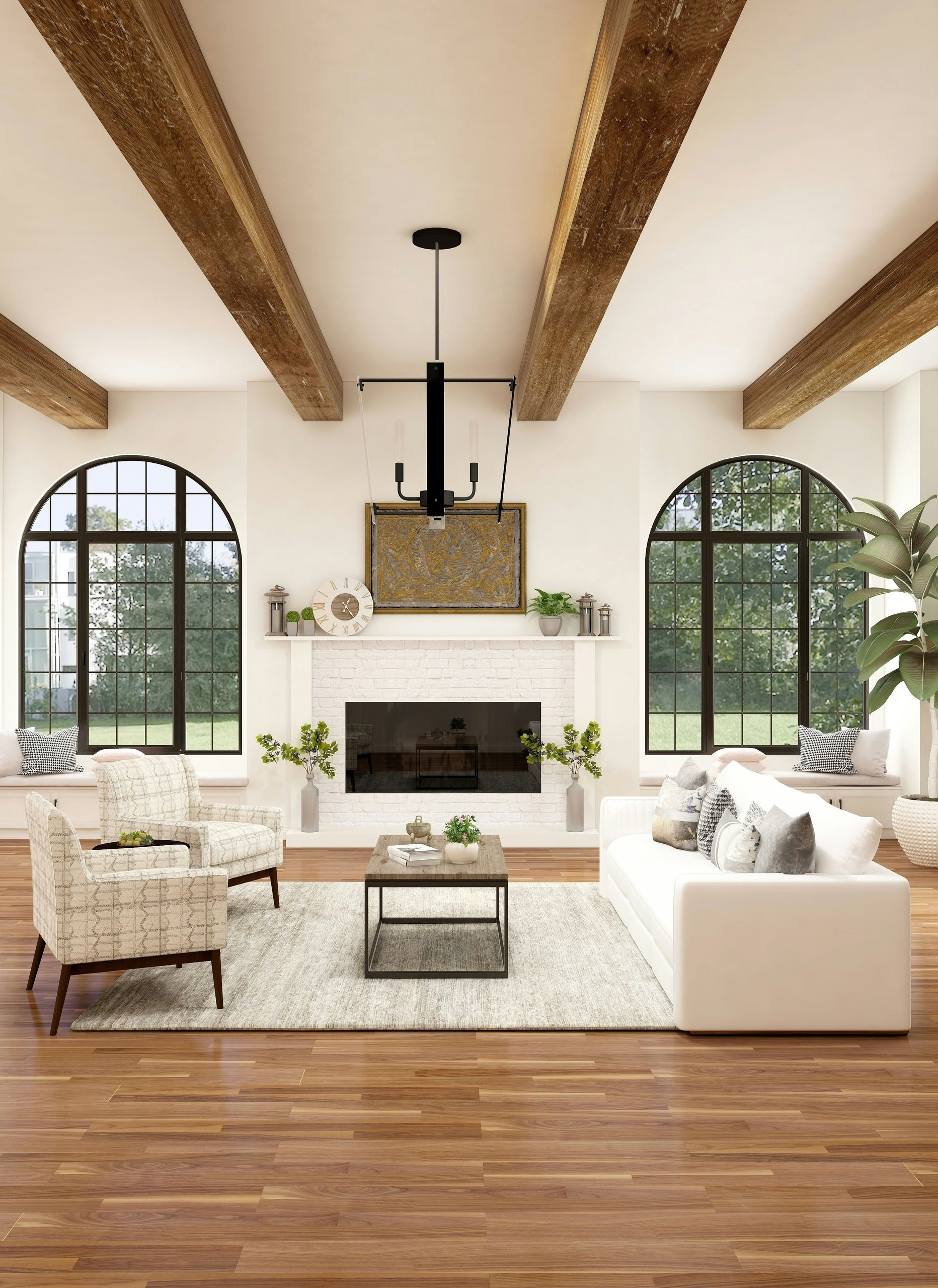 A bright living room with exposed wood ceiling beams, arched windows, a stone fireplace, and contemporary seating.