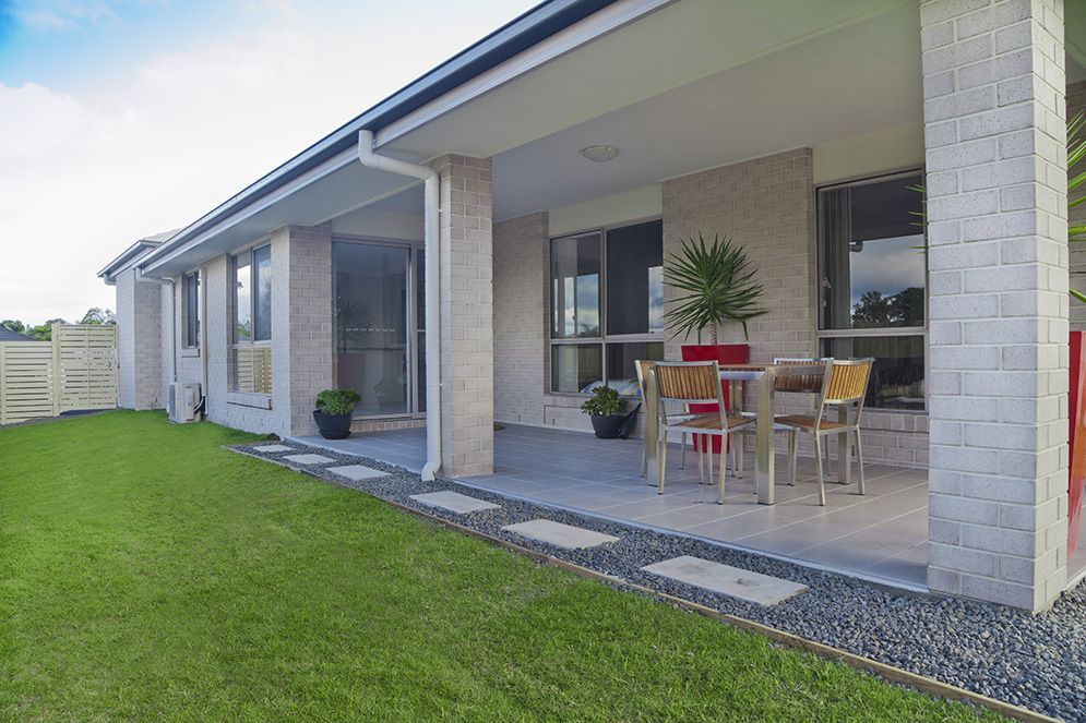 A House With a Patio and a Table and Chairs on It — Highfields Turf in Westbrook, QLD