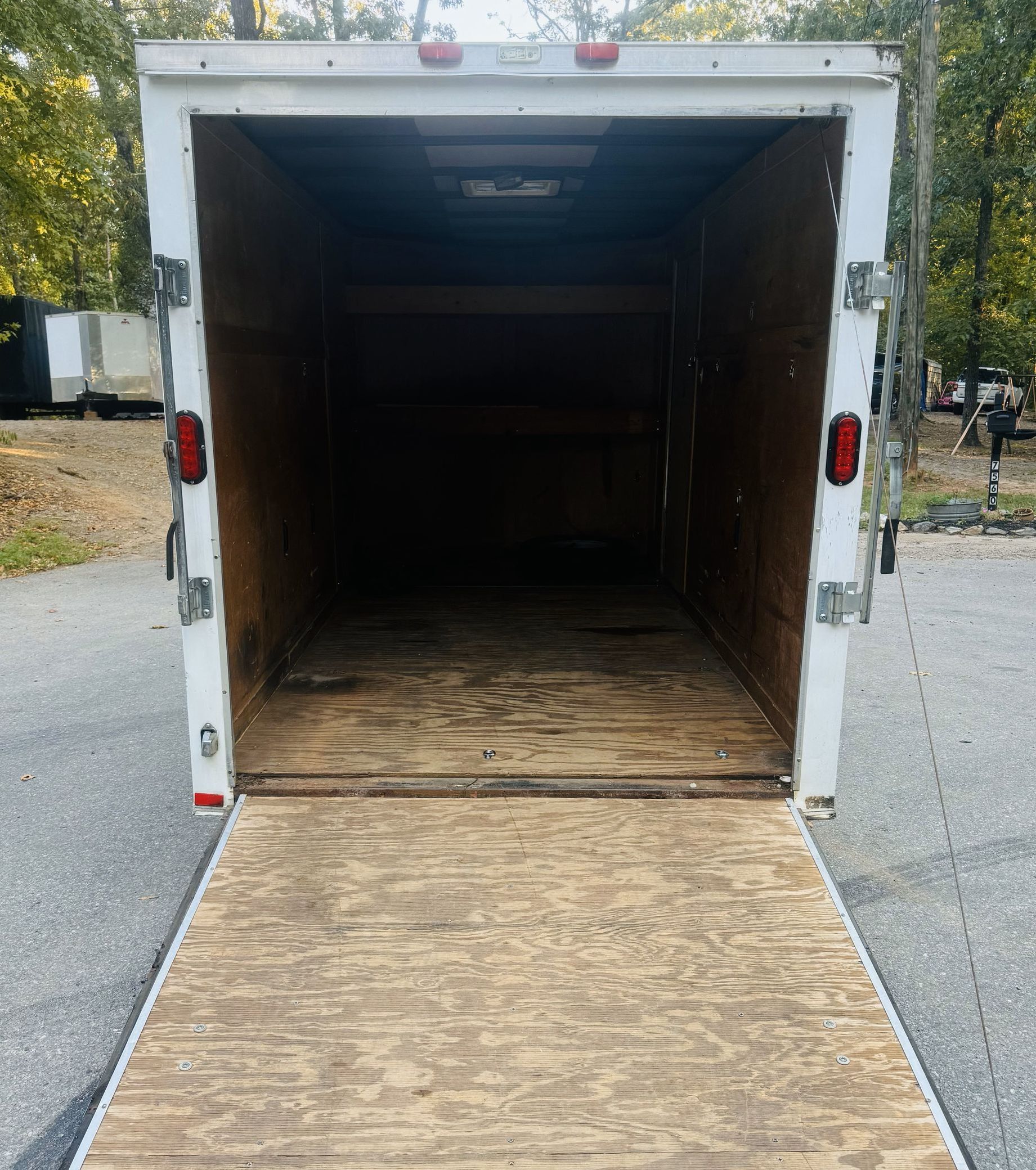 The back of a white trailer with the door open
