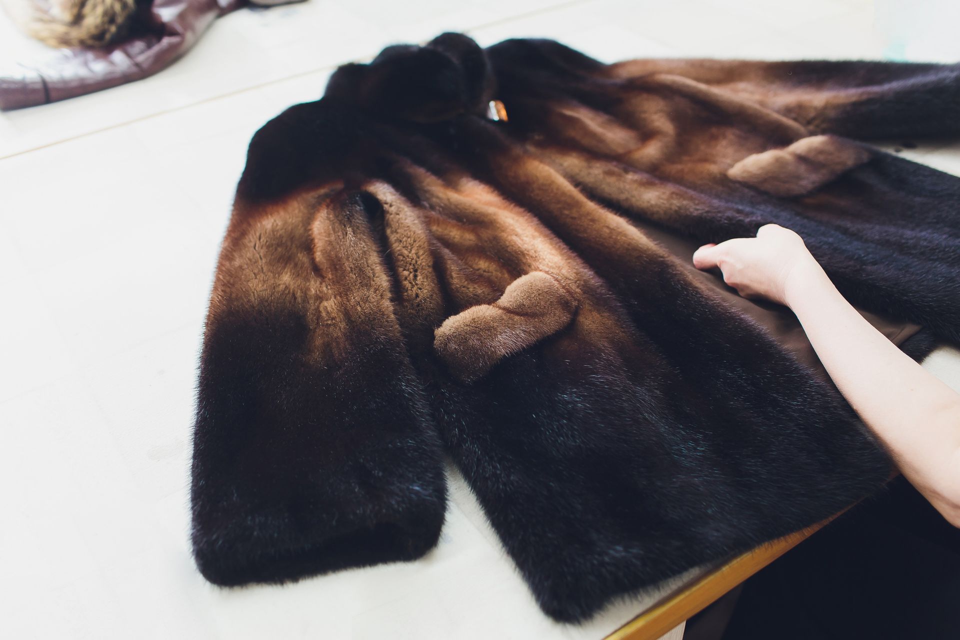 Working With Fur Coat and Brush — Atlanta, GA — Atlanta Furs