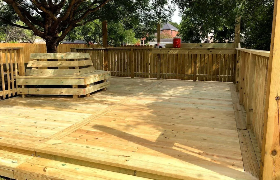 Wooden deck with built-in bench.