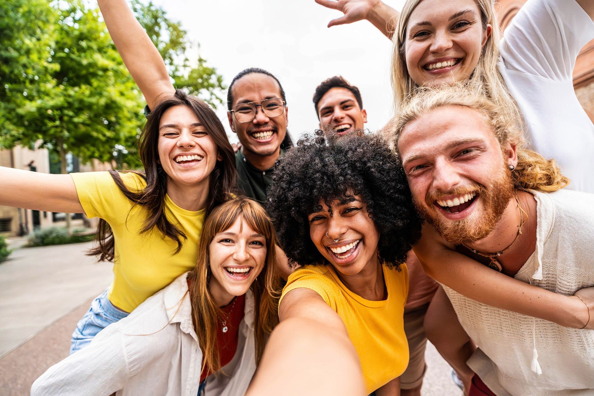 A group of young people are taking a selfie together.