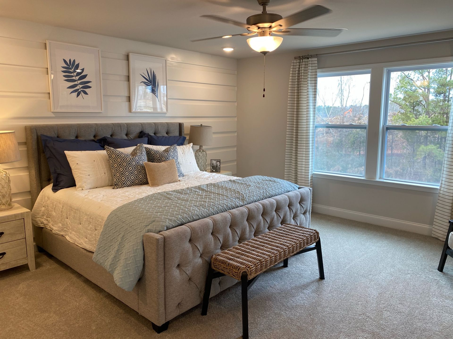 a bedroom shiplap accent wall and a large bed - HOMEVIBES Raleigh, NC