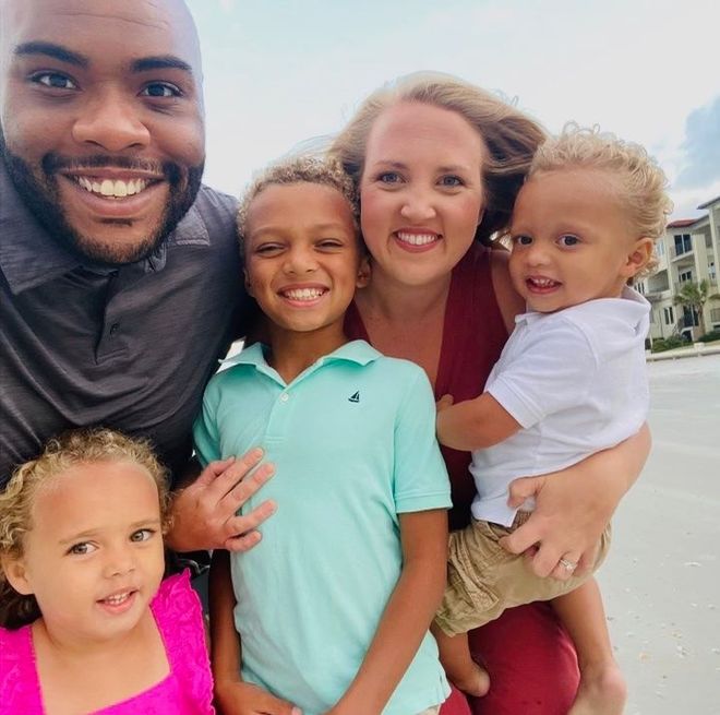 a family posing for a picture on a beach - Fred Johnson NC Realtor