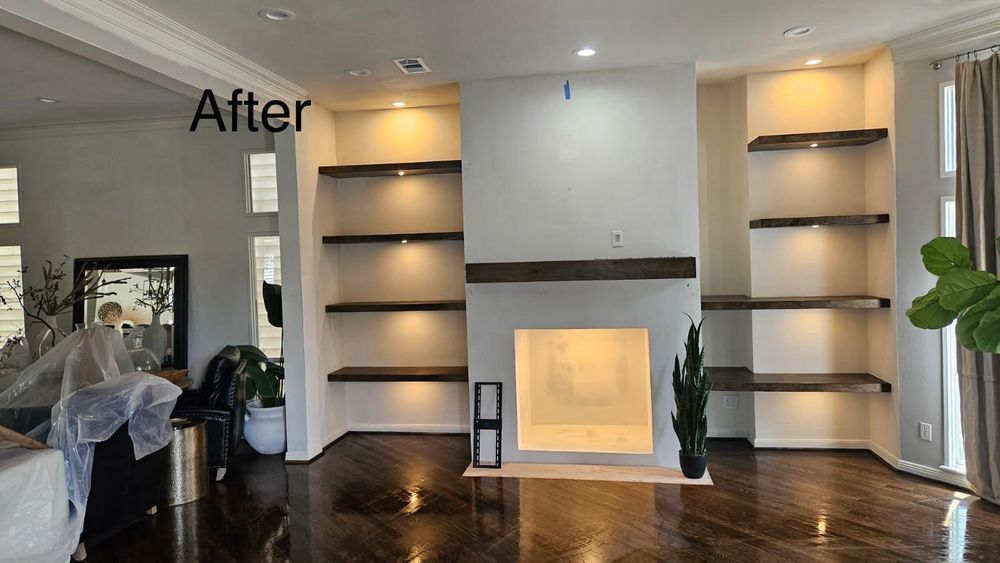 Modern living room with built-in shelves and a glowing fireplace, dark wood floor, labeled “After”