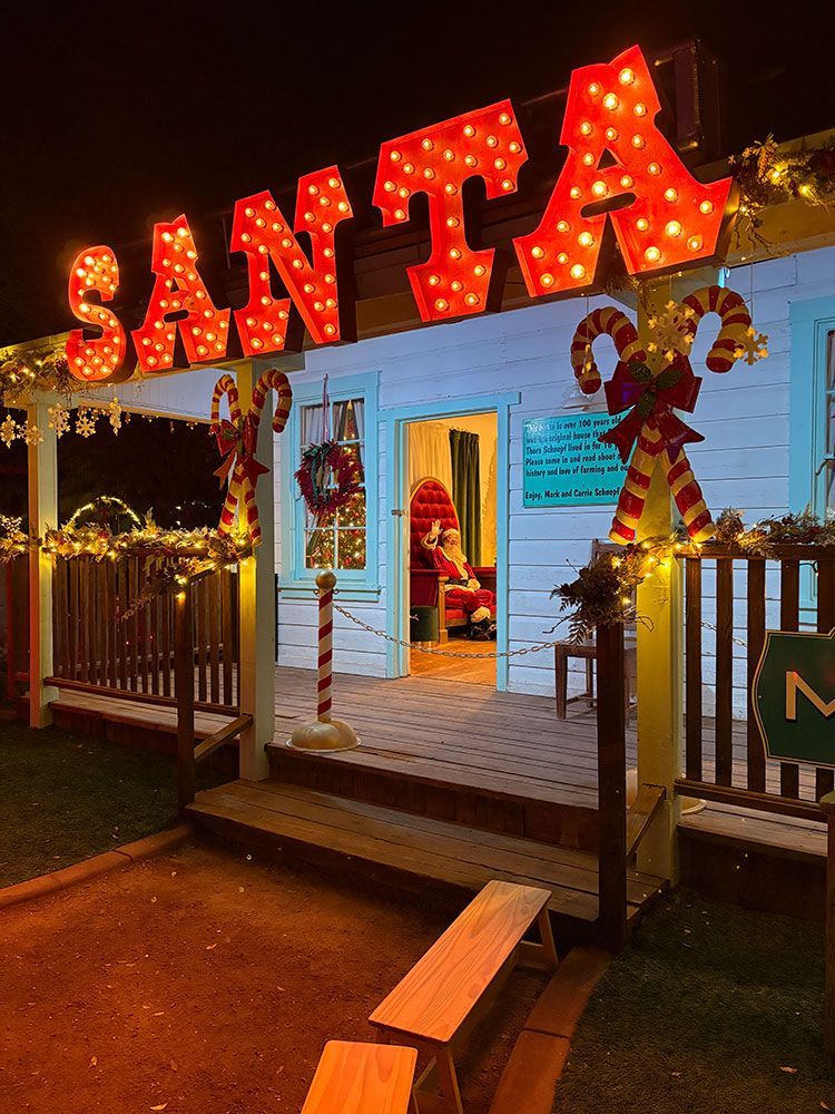 Santa sits on his throne inside the Santa Workshop