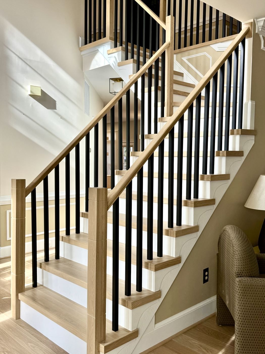 White oak staircase with black iron balusters