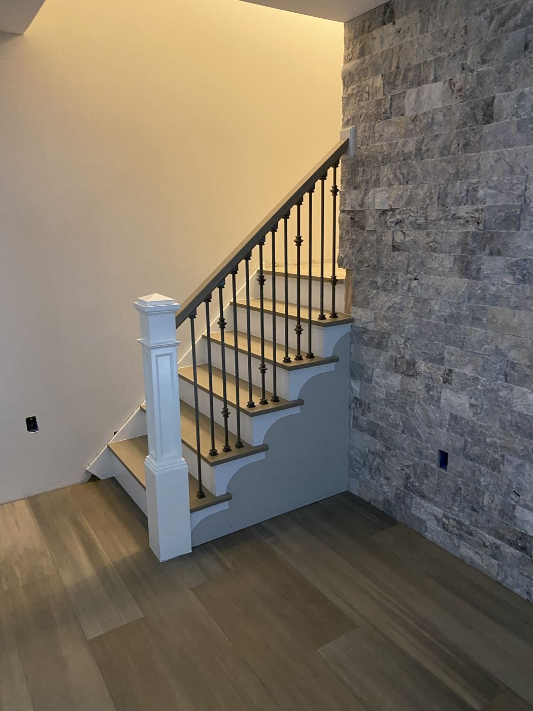 Stair remodel with stone accent wall
