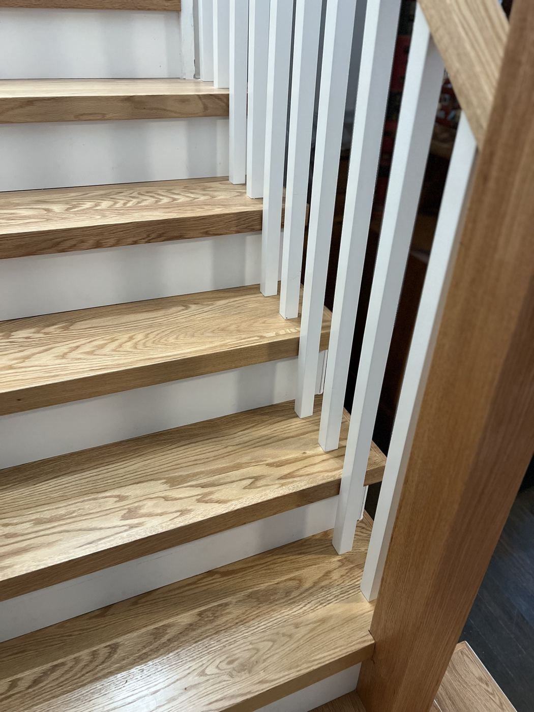 Oak treads and white square balusters close-up