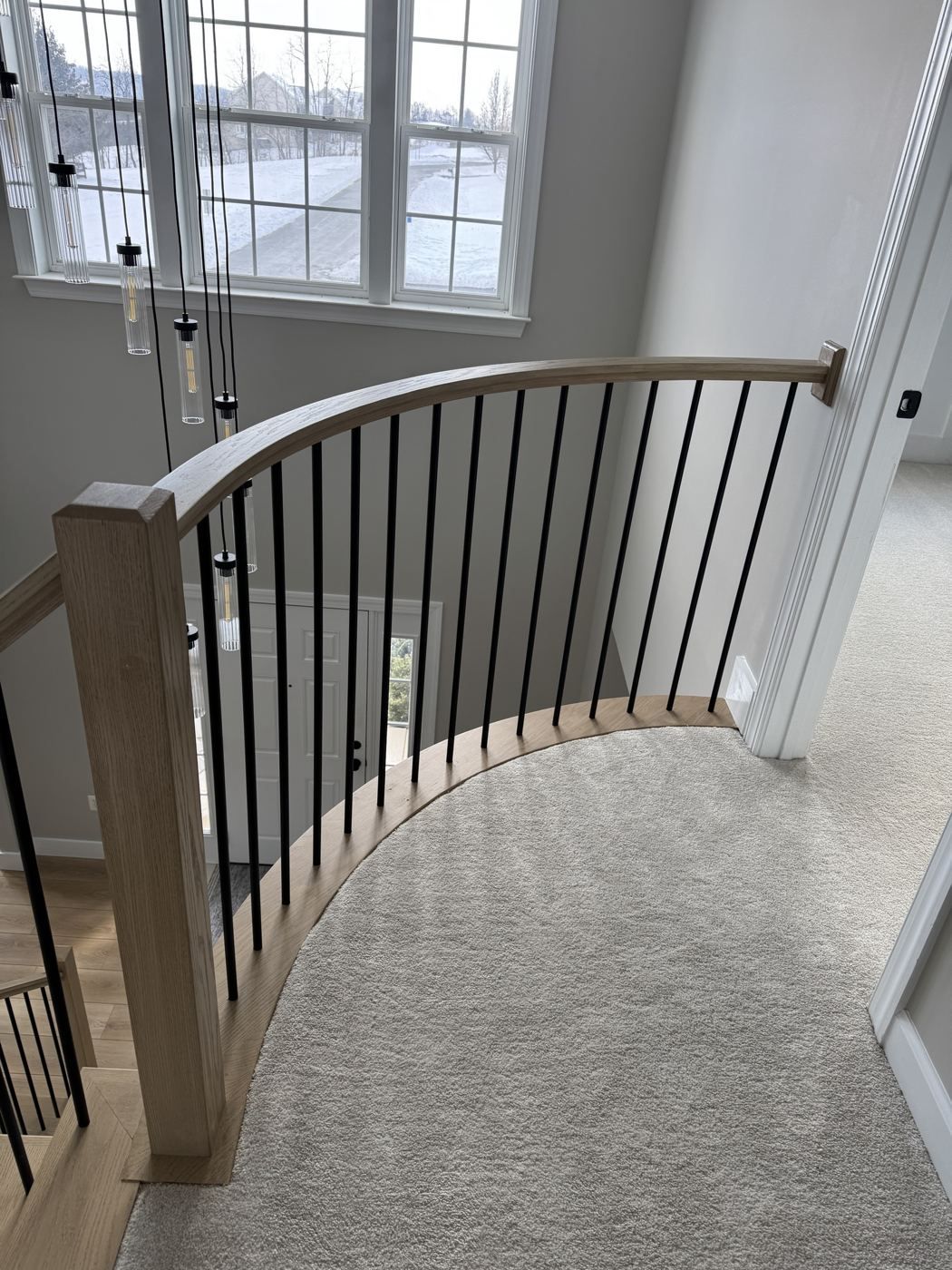 Overhead view of white oak stairs and foyer