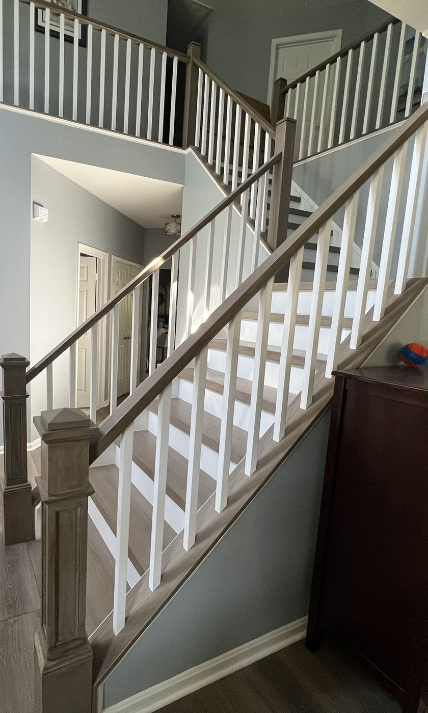 After: gray-washed treads, rail and box newels with square white balusters