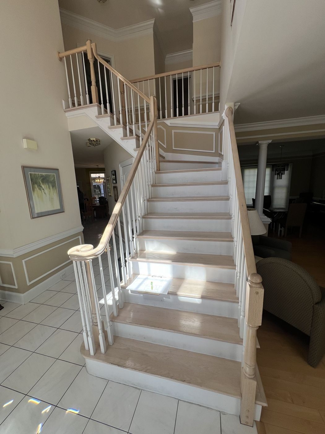 Before: whitewashed treads, turned balusters and a volute handrail