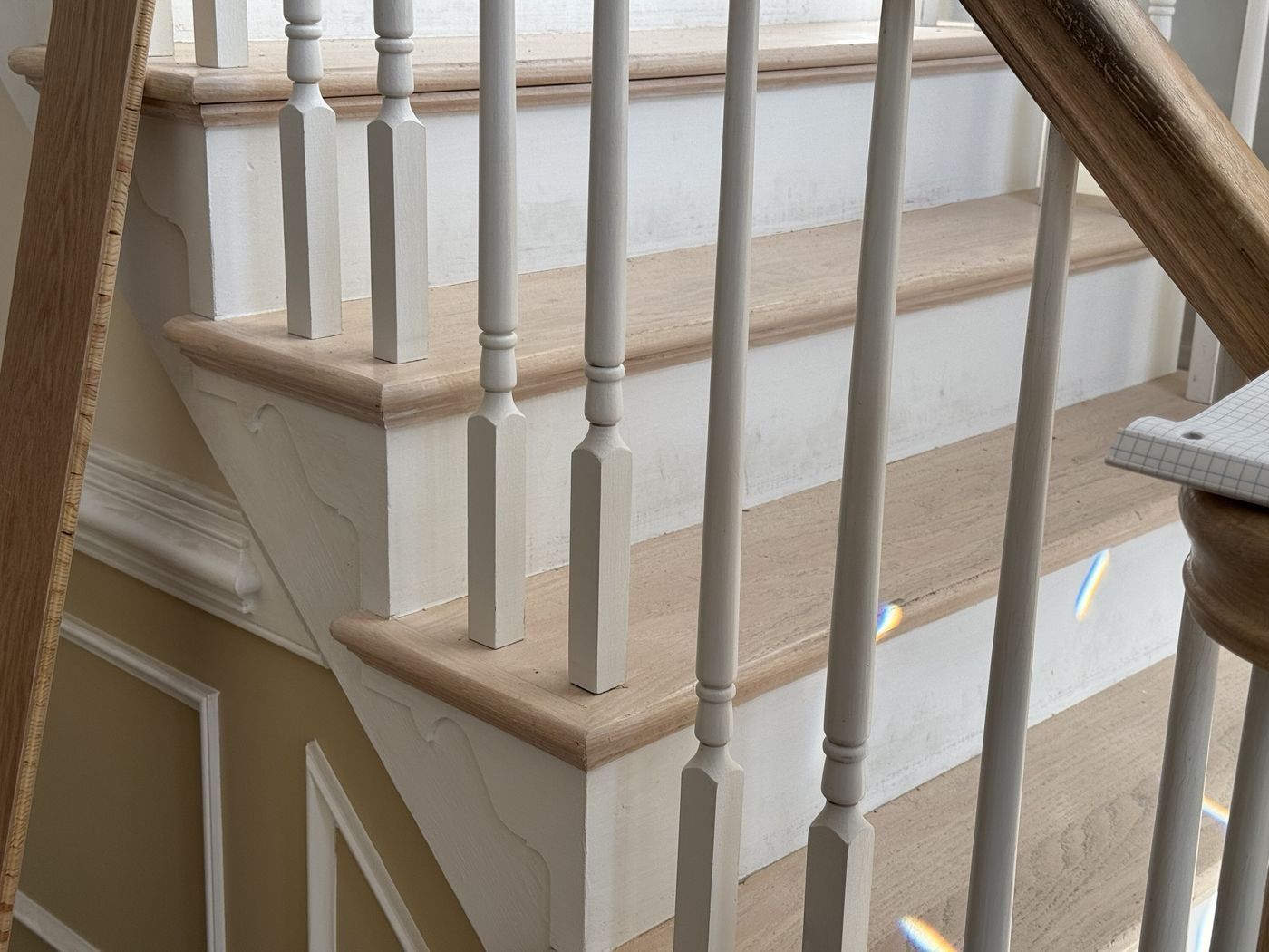 Before close-up: worn whitewashed treads and turned balusters