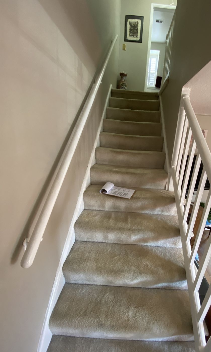 Before: painted white railing and worn runner