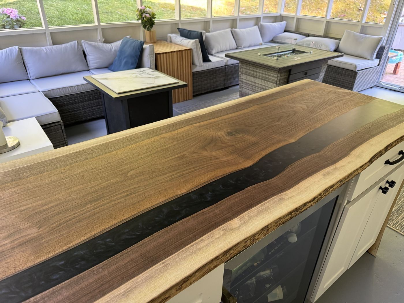 Live-edge walnut river bar top with black resin