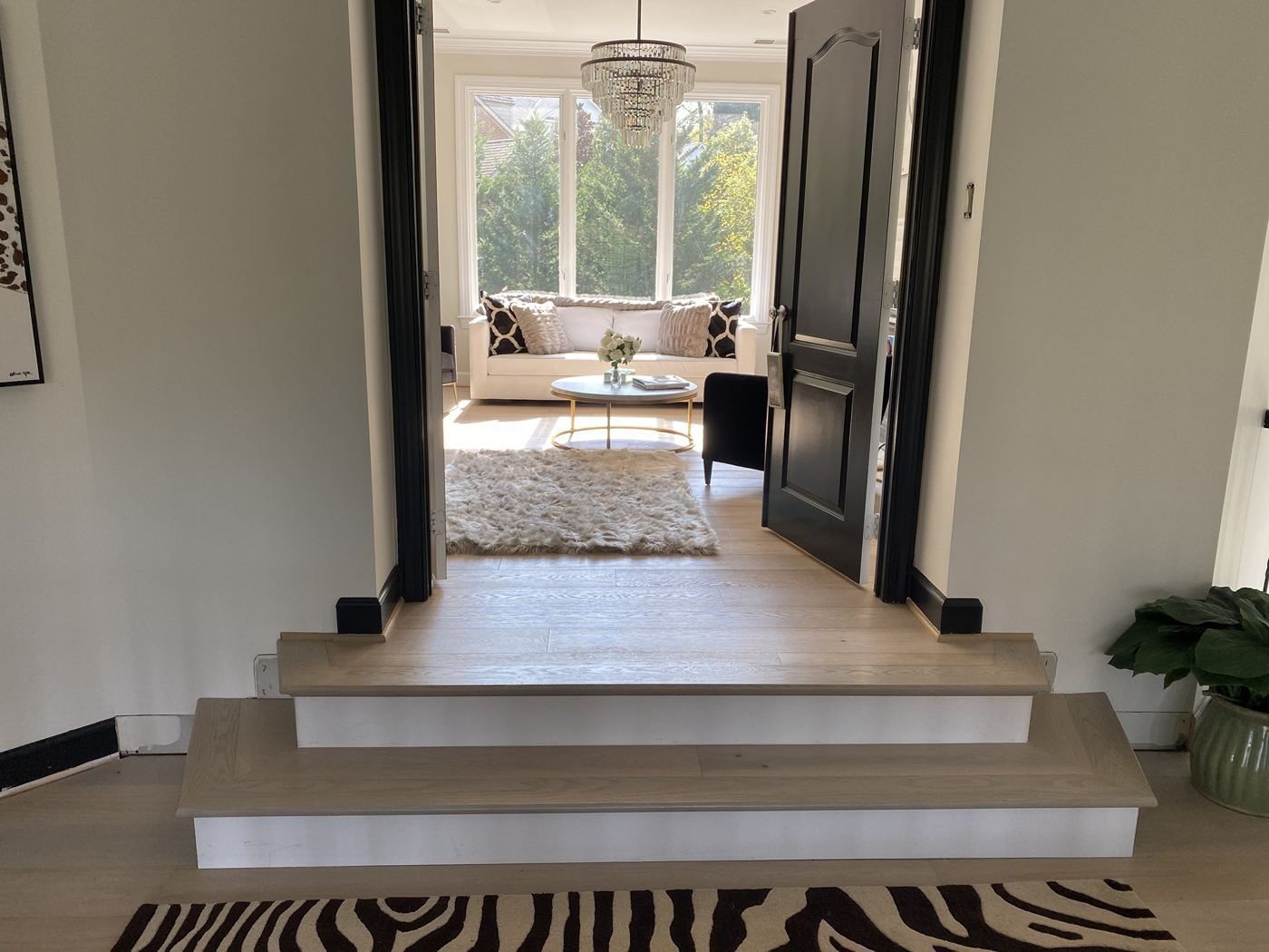 Wide-plank hardwood floor and step-down