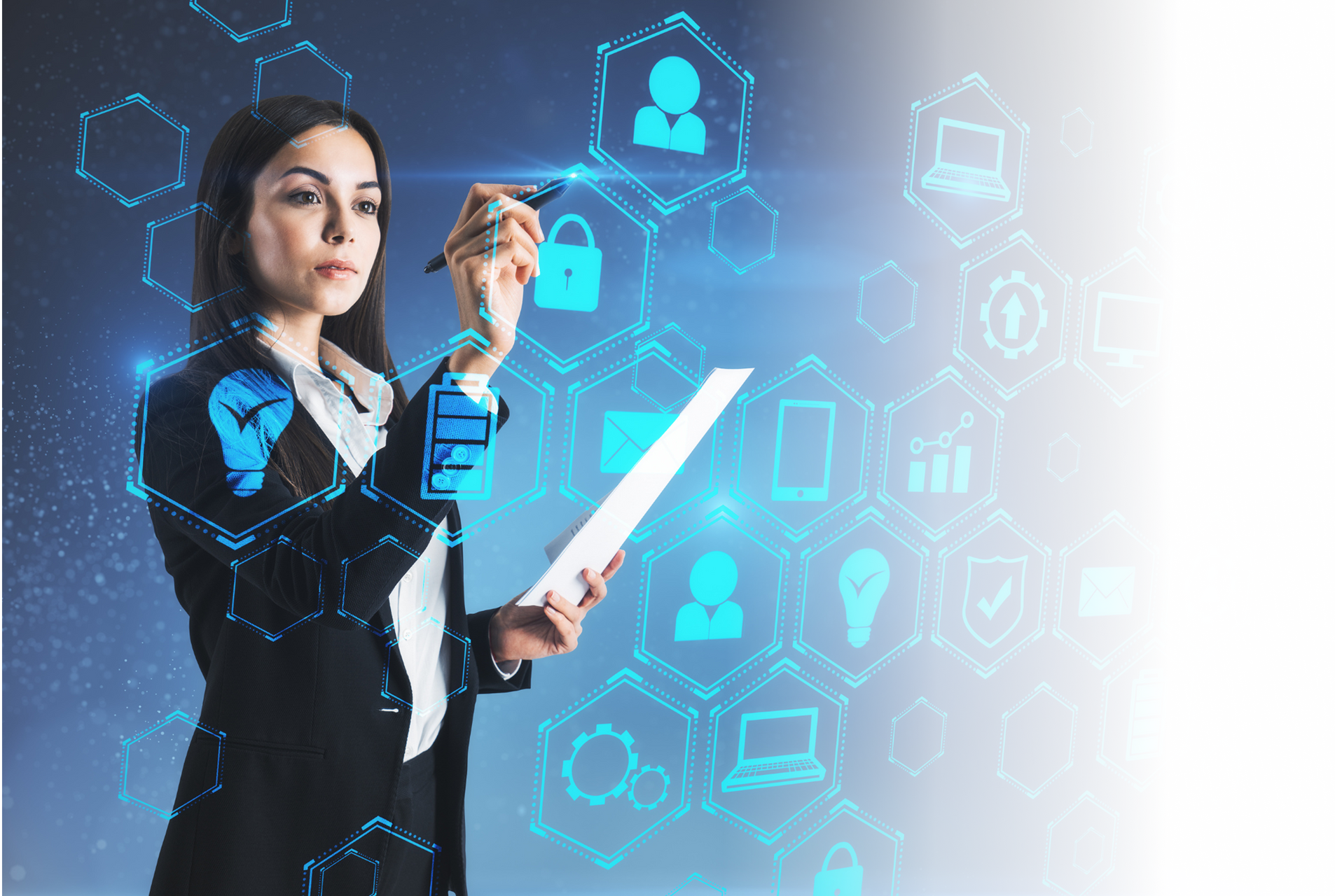 Businesswoman in suit drawing on a digital screen with tech icons.