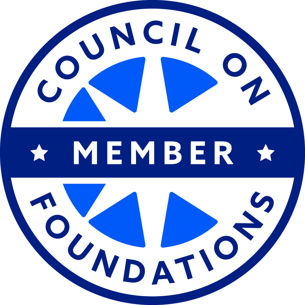A blue and white logo for the council on foundations