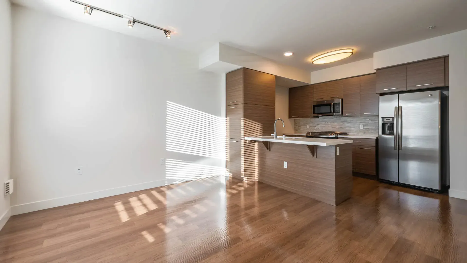Modern kitchen with stainless steel appliances and island