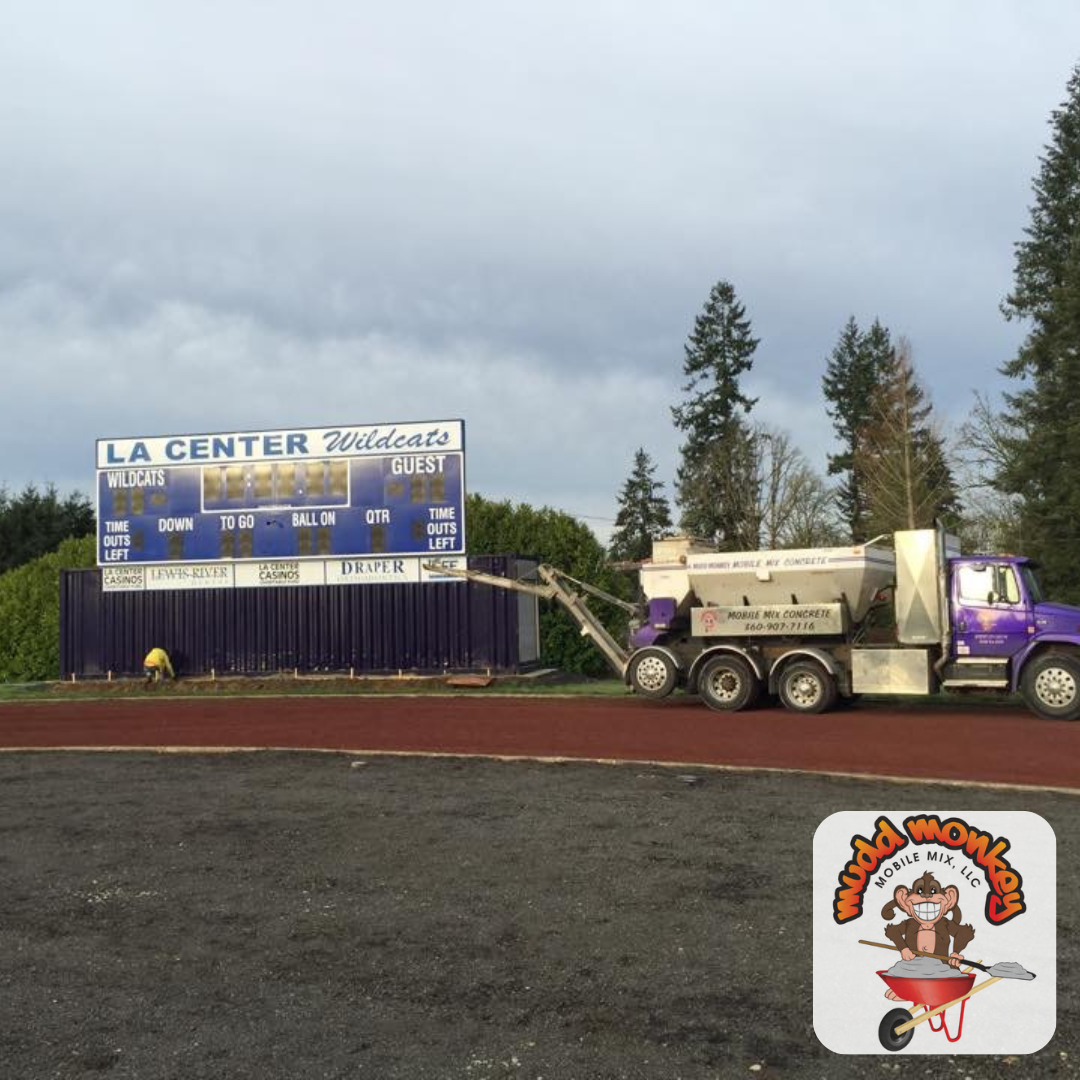 concrete photo of concrete finisher setting up concrete forms near you, and the mudd monkey mobile mix is getting ready to pour concrete