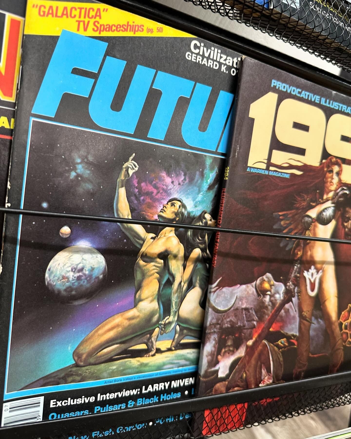 Rack of colorful sci-fi magazines, including a Futu cover with a space scene and a “198” issue.