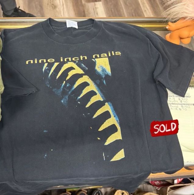 Black Nine Inch Nails T-shirt with yellow graphic, marked sold