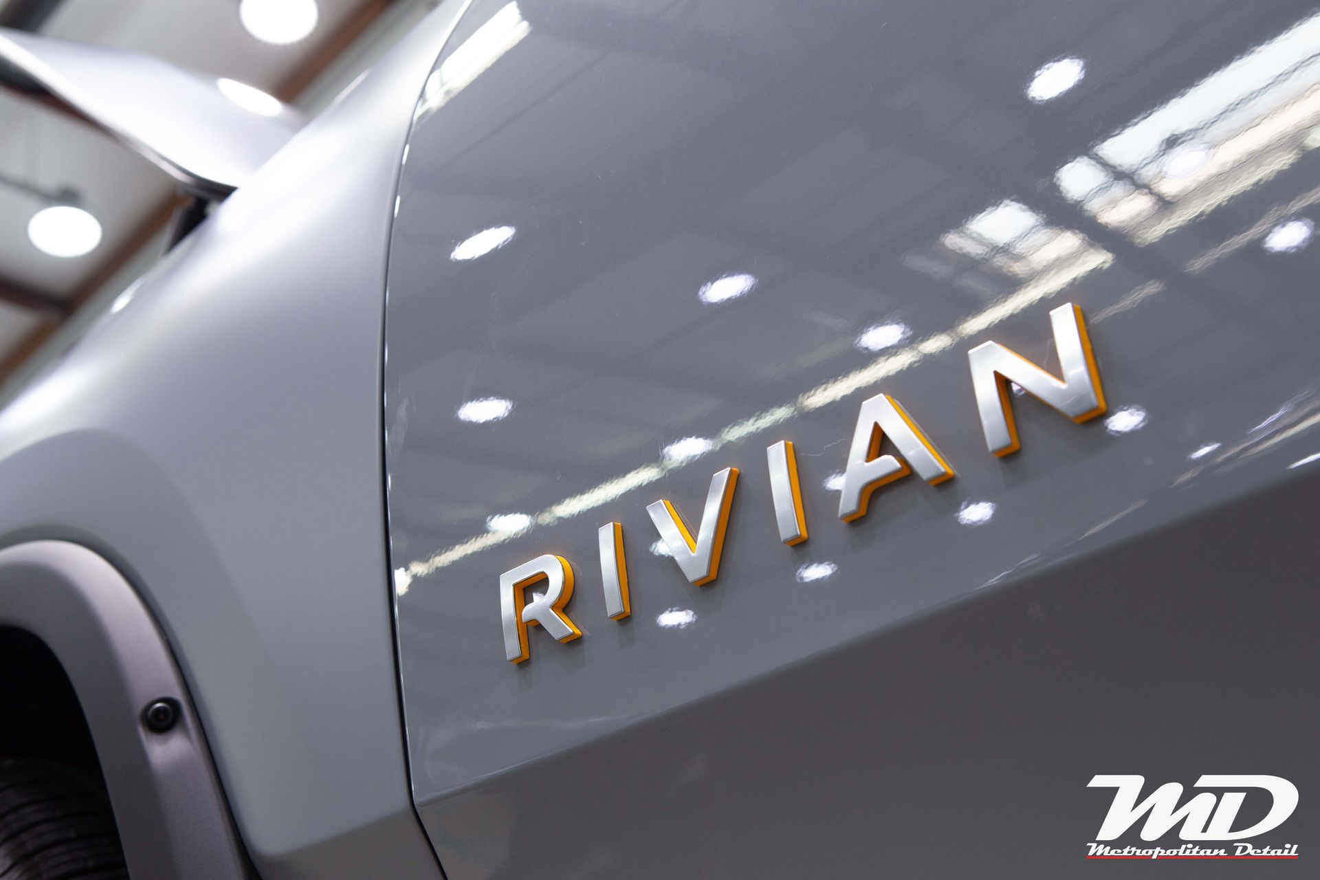 The word rivian is on the side of a car
