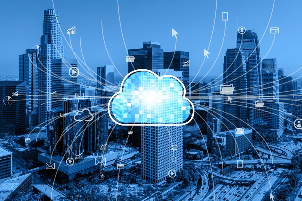 An aerial view of a city with a cloud in the middle of it.