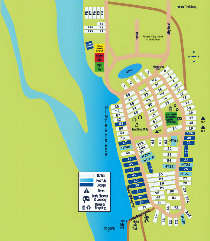 Color-coded campground map with roads, numbered sites, lake, and facilities along a shoreline