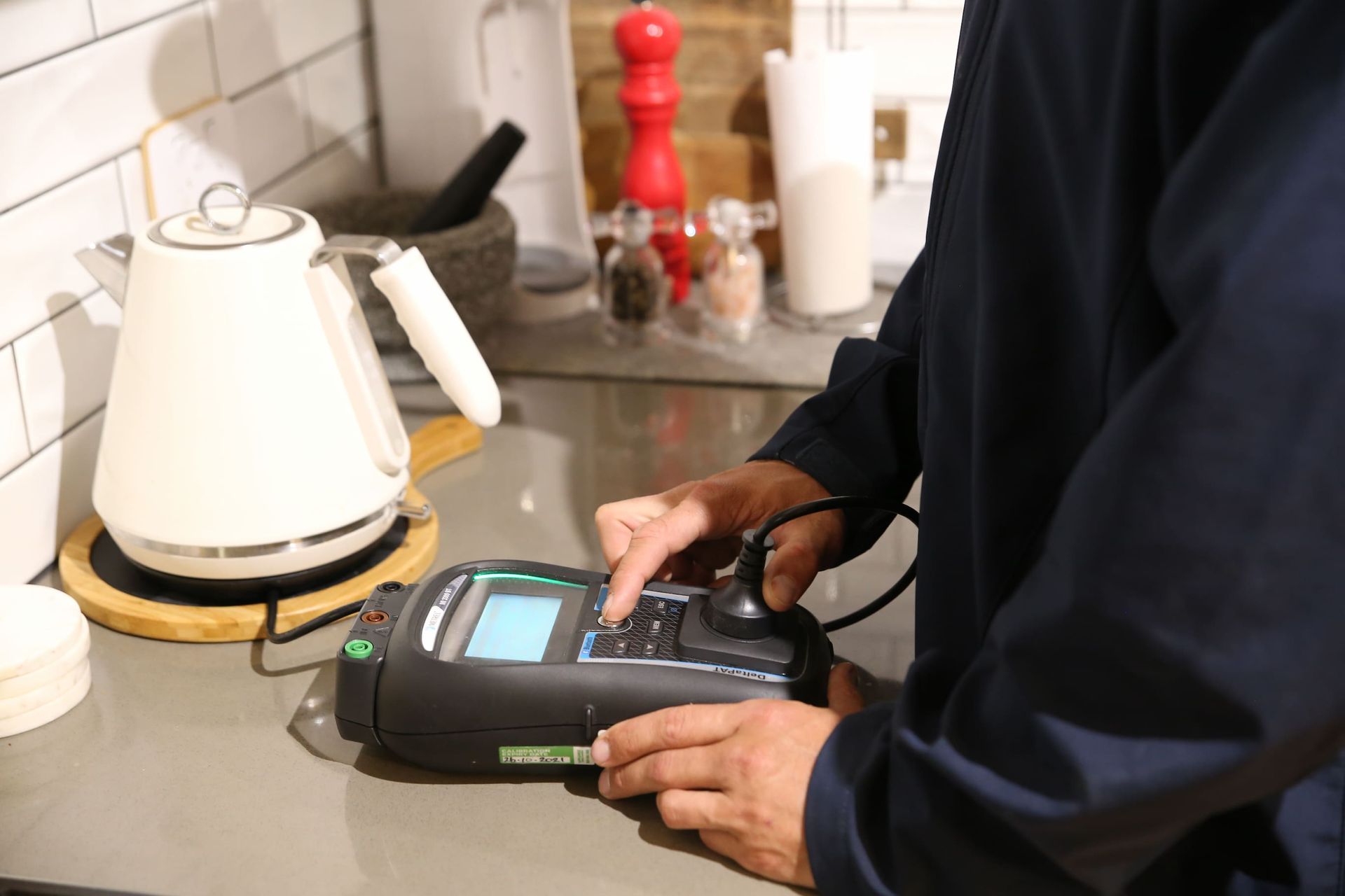 Electrician Testing Home Appliances - Electrician Gold Coast