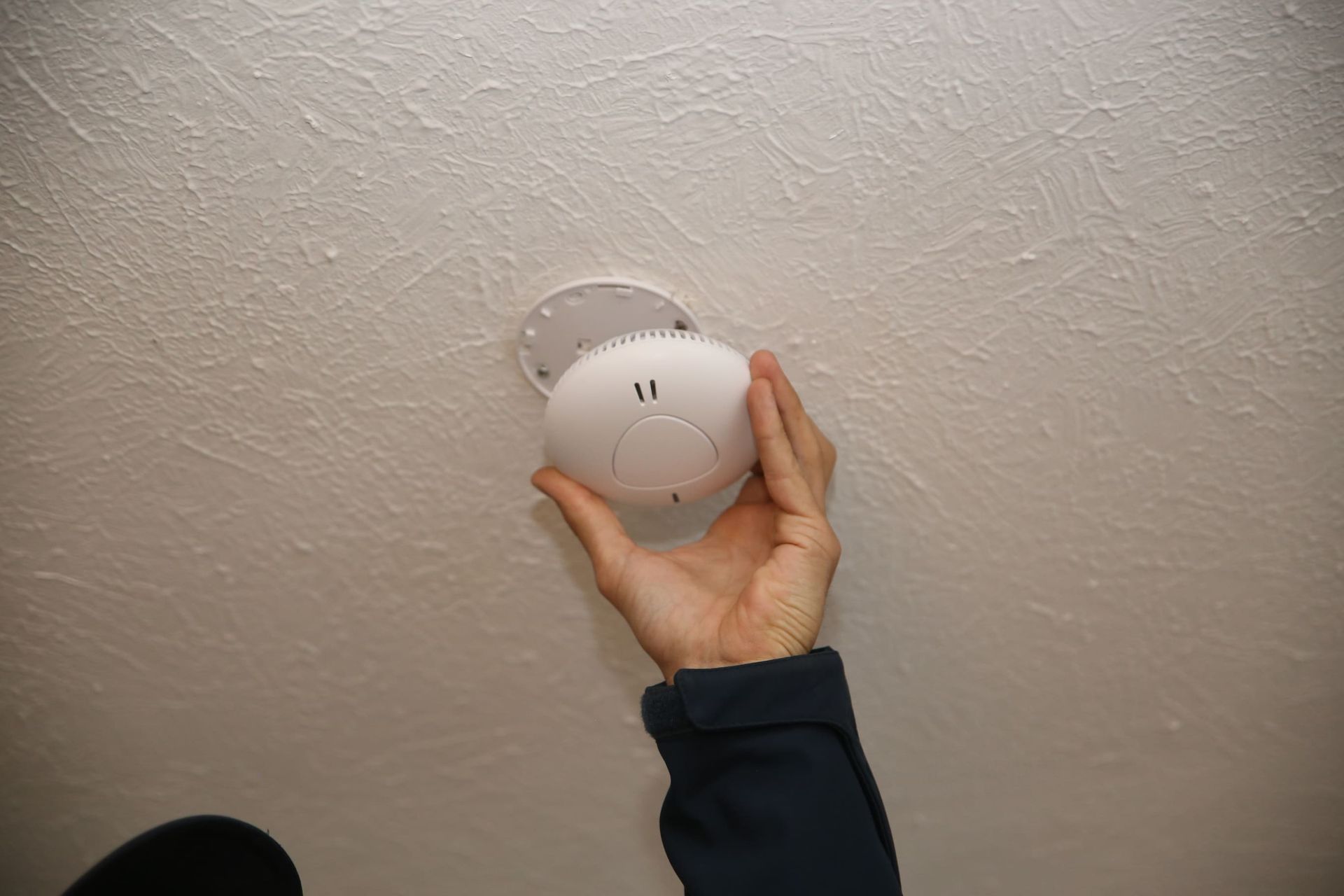 A smoke alarm being checked in Currumbin