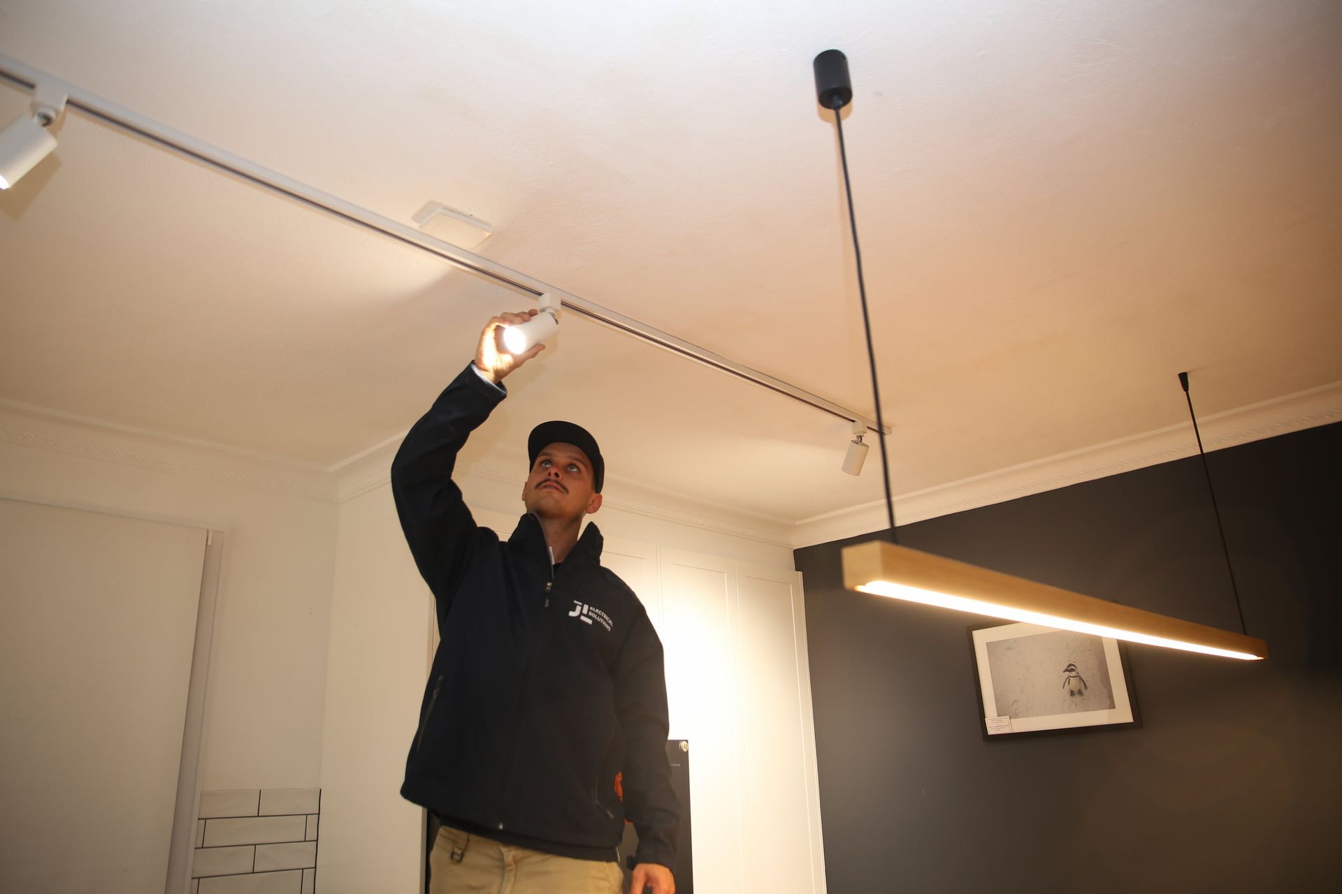 Electrician Checking Lighting - Electrician Gold Coast