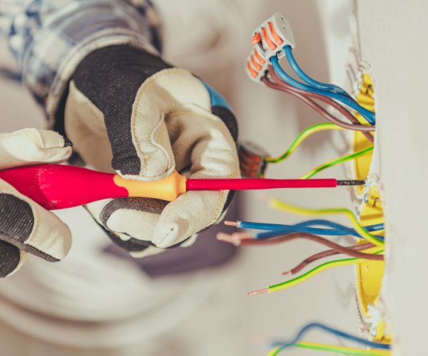 Electrician installing a power point - Electrician Robina