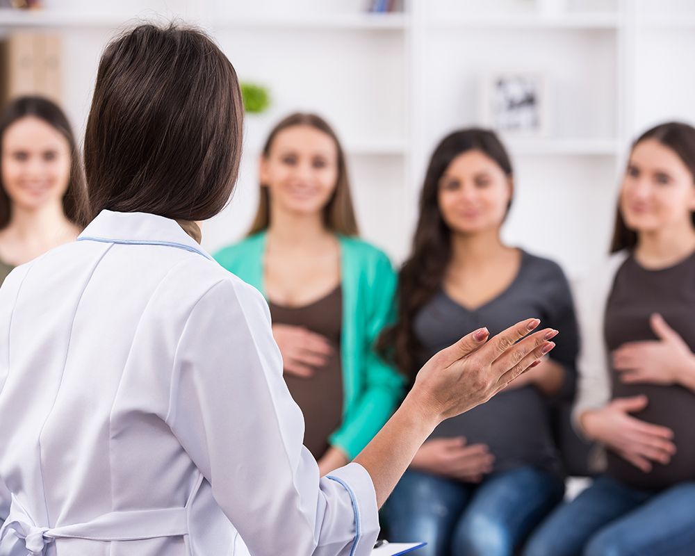 Doctor is Talking to a Group of Pregnant Women