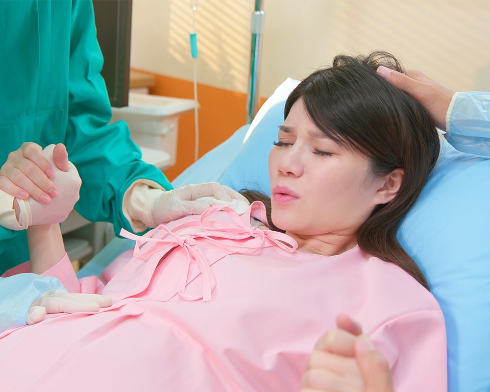 Pregnant Woman in a Hospital Bed